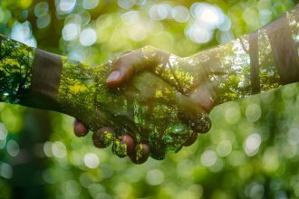 double-exposure-image-depicting-handshake-overlaid-with-lush-green-forest-symbolizing double-exposure-image-depicting-handshake-overlaid-with-lush-green-forest-symbolizing